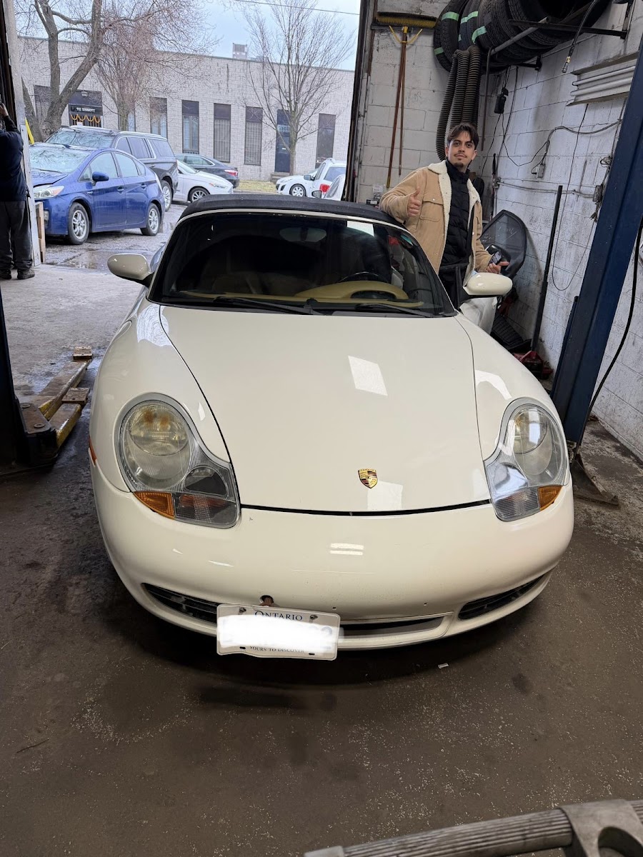 Customer vehicle inside The Car Doctor service bay